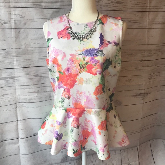 H&M Tops - Donating soon! Floral peplum top